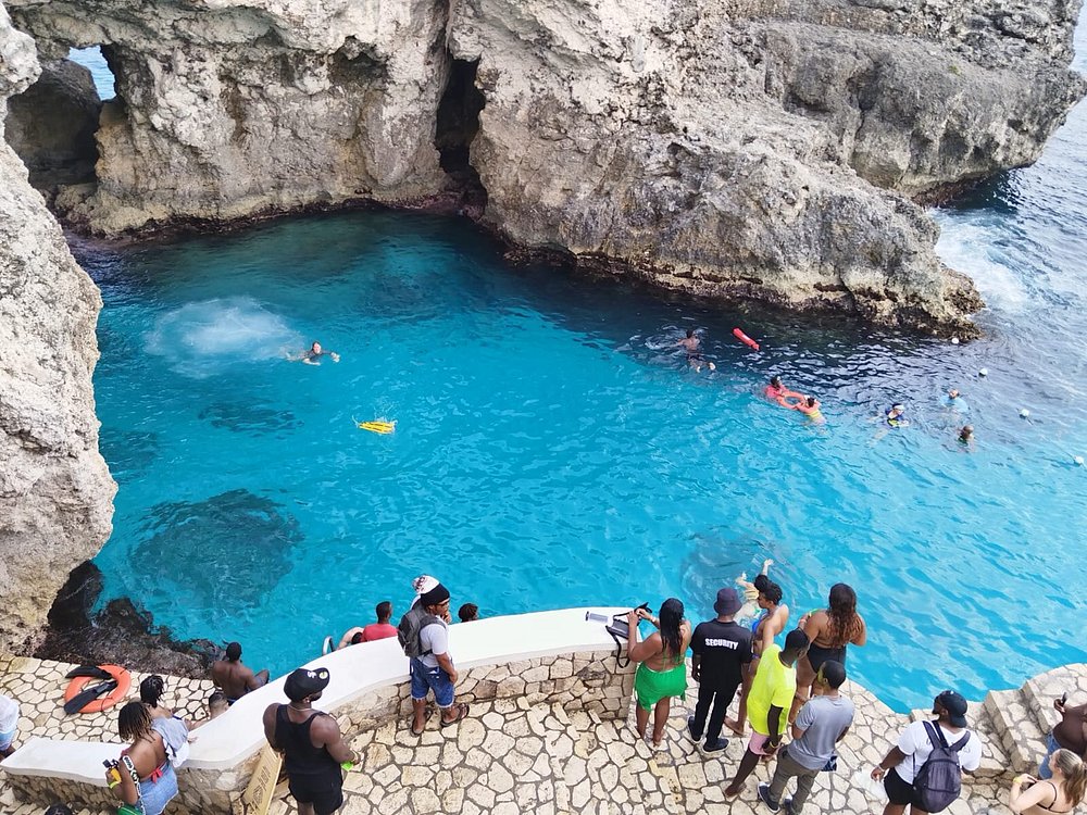 Cliff divers at Rick's Cafe plunging into the turquoise sea