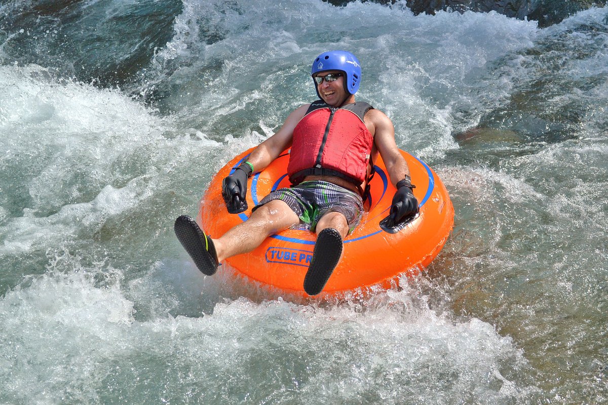 Excited adventurers navigating thrilling rapids on the Rio Bueno in Jamaica